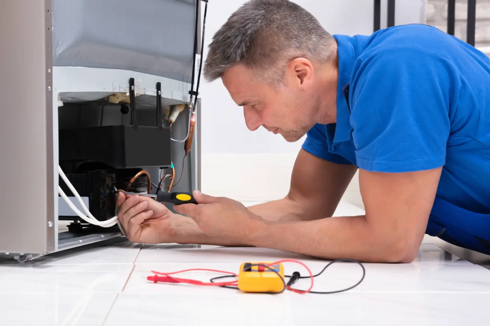 Independent appliance service professional testing cooling appliance components