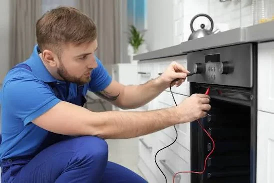 Independent appliance service professional testing a built-in stove and oven